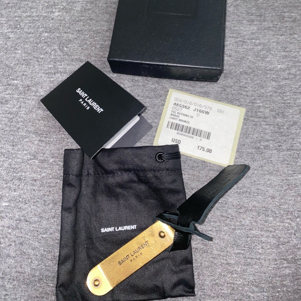 Gold colored YSL money clip